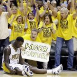 Indiana Pacers fans react after Lance Stephenson, sitting, made a shot against the Miami Heat as time expired in the third quarter of Game 4 of the NBA basketball Eastern Conference finals, Tuesday, May 28, 2013, in Indianapolis. (AP Photo/Michael Conroy)