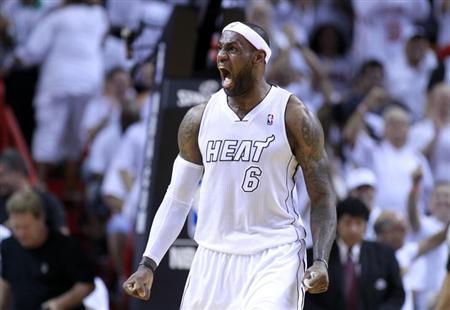 Miami Heat forward LeBron James reacts after dunking the ball in the fourth quarter as the Heat defeated the Milwaukee Bucks in their NBA first round Game 2 playoff basketball game in Miami, Florida April 23, 2013 file photo. REUTERS/Joe Skipper