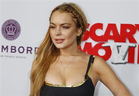 Actress Lindsay Lohan arrives at the premiere of the film "Scary Movie 5" in Hollywood April 11, 2013. REUTERS/Fred Prouser