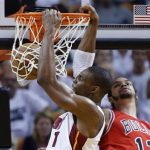 Miami Heat's Chris Bosh (L) slam dunks over Chicago Bulls' Joakim Noah during Game 2 of their NBA Eastern Conference semi-final basketball playoff in Miami, Florida May 8, 2013. REUTERS/Joe Skipper