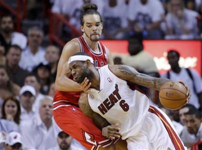 Miami Heat's LeBron James (6) drives past Chicago Bulls' Joakim Noah during the fourth quarter in Game 5 of their NBA Eastern Conference semi-final basketball playoff in Miami, Florida May 15, 2013. REUTERS/Joe Skipper