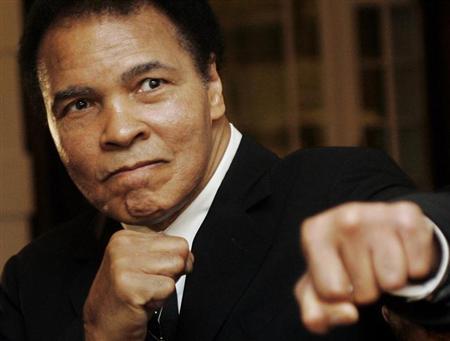 U.S. boxing great Muhammad Ali poses during the Crystal Award ceremony at the World Economic Forum (WEF) in Davos, Switzerland January 28, 2006. REUTERS/Andreas Meier