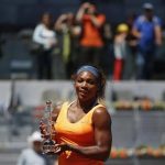 Serena Williams of the U.S. poses with the Ion Tiriac's trophy after winning the Madrid Open final tennis match over Maria Sharapova of Russia in Madrid May 12, 2013. REUTERS/Susana Vera