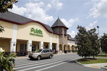 A vehicle passes the front of the Publix supermarket in Zephyrhills, Fla., Sunday, May 19, 2013. The highest Powerball jackpot worth an estimated $590.5 million was sold recently at this Publix supermarket. (AP Photo/Scott Iskowitz)