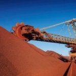 Australia's central bank cuts key interest rate to record low