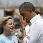 U.S. President Barack Obama wipes away tears after hugging Plaza Tower Elementary School Principal Amy Simpson in Moore, Oklahoma, May 26, 2013. REUTERS/Jonathan Ernst
