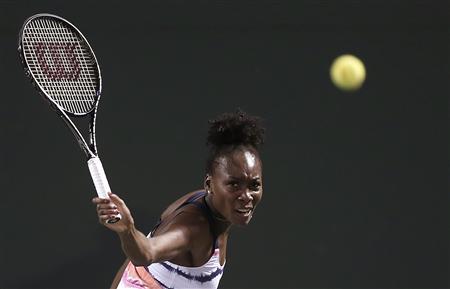 Venus Williams of the U.S. returns a shot to Kimiko Date-Krumm of Japan at the Sony Open tennis tournament in Key Biscayne, Florida March 21, 2013. REUTERS/Andrew Innerarity
