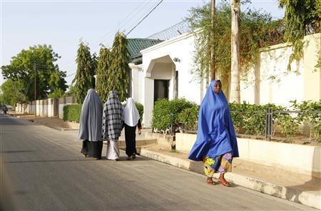 Women walk in a street in a residential area in Maiduguri, Borno State May 19, 2013, an area where President Goodluck Jonathan has declared a state of emergency. REUTERS/Afolabi Sotunde
