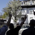 Protesters gesture outside the Graham, Putnam, and Mahoney Funeral Parlors in Worcester, Mass., Monday, May 6, 2013, where the body of killed Boston Marathon bombing suspect Tamerlan Tsarnaev is being prepared for burial. Funeral director Peter Stefan has pleaded for government officials to use their influence to convince a cemetery to bury Tsarnaev, but so far no state or federal authorities have stepped forward. (AP Photo/Elise Amendola)