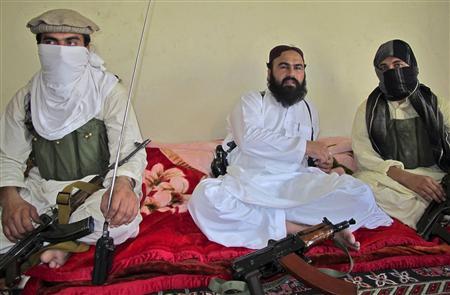 Deputy Pakistani Taliban leader Wali-ur-Rehman (C) is flanked by militants as he speaks to a group of reporters in Shawal town, which lies between North and South Waziristan region in the northwest bordering Afghanistan, in this July 28, 2011 file photo. REUTERS/Saud Mehsud/File