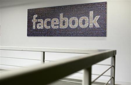 The Facebook logo is pictured in the Facebook headquarters in Menlo Park, California January 29, 2013. REUTERS/Robert Galbraith