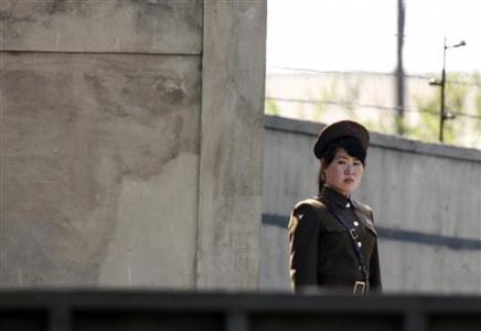 A North Korean soldier stands guard on the banks of Yalu River, near the North Korean town of Sinuiju, opposite the Chinese border city of Dandong, May 20, 2013. REUTERS/Jacky Chen
