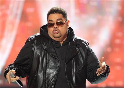 FILE - In this Oct. 1, 2011 photo, rapper Heavy D, also known as Dwight Arrington Myers, performs during the BET Hip Hop Awards in Atlanta.  The culture that in the 1990s lost its brightest stars to gun violence has in recent years seen a series of notable rappers die of drug- and health-related causes. Since 2011, hip-pop pioneer Heavy D, singer and rap chorus specialist Nate Dogg and New York rapper Tim Dog all died of ailments in their 40s. (AP Photo/David Goldman, file)