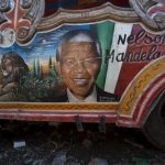 A painting depicting former South African President Nelson Mandela is featured on the side of a public bus in Port-au-Prince, Haiti, Wednesday, June 12, 2013. Mandela began responding better to treatment Wednesday morning for a recurring lung infection following a difficult last few days, South Africas President Jacob Zuma said. Mandela spent a fifth straight day Wednesday in a Pretoria hospital, where he was visited by one of his daughters and two granddaughters. ( Photo/ Dieu Nalio Chery)