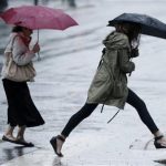 A woman leaps across a puddle during a rainstorm Friday, June 7, 2013, in Philadelphia. The National Weather Service has issued a flash flood watch for much of southeastern Pennsylvania as remnants of tropical Storm Andrea move through the region. (AP Photo/Matt Rourke)