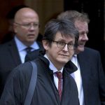 FILE - This is a Tuesday, Dec. 4, 2012 file photo of the editor of the Guardian newspaper Alan Rusbridger as he leaves Downing street after a meeting of fellow newspaper editors and the British Prime Minister David Cameron following the release of the Leveson media inquiry in London. The Guardian newspaper, which started publishing in the English city of Manchester in 1821 and is now based in London, has in the last two days established a major presence in Washington by uncovering the vast scope of secret surveillance operations carried out by U.S. officials. The revelations have put President Barack Obama and his national security team on the defensive with reports of government snooping on a comprehensive scale. Its coverage expanded to Britain on Friday June 7, 2013 with an exclusive report that Britains electronic surveillance agency has had access to data collected by the Americans. (AP Photo/Alastair Grant, File)