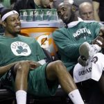 FILE - Boston Celtics center Kevin Garnett, right, chats with teammate Paul Pierce on the bench during the fourth quarter of an NBA basketball game against the Toronto Raptors in Boston, in this March 13, 2013 file photo. The Brooklyn Nets will acquire Paul Pierce and Kevin Garnett from the Boston Celtics in a deal that was still developing as the NBA draft ended, according to a person with knowledge of the details. The trade can't be completed until July 10, after next season's salary cap is set, so pieces were still being discussed early Friday June 28, 2013. (AP Photo/Elise Amendola, File)