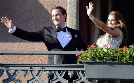 Christopher O'Neill, from the US, left, and Swedish Princess Madeleine, right, wave from the balcony of the Grand Hotel in Stockholm, Sweden, Friday June 7, 2013, prior to a dinner for the couple at the hotel, the day before their wedding. Three years ago she crossed the Atlantic with a broken heart. Now Sweden's "party princess" returns from New York to Stockholm to tie the knot with her new, British-American love. On Saturday, Princess Madeleine the Duchess of Halsingland and Gastrikland will wed New York banker Christopher O'Neill in the Swedish capital, bringing together European royals and top New York socialites for a grand celebration. (AP Photo/Scanpix Sweden/Bertil Enevag Ericson) SWEDEN OUT