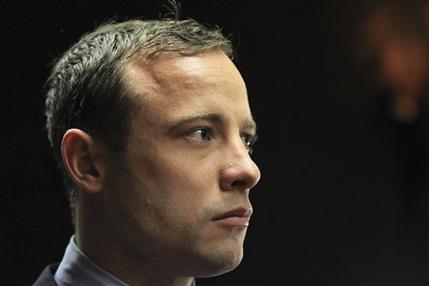 Double-amputee Olympian, Oscar Pistorius, looks on as he appears in the magistrates court in Pretoria, South Africa, Tuesday, June 4, 2013. Pistorius is back in the glare of public scrutiny for the first time in months when he appeared, launching the next chapter of a sensational case that transformed the double-amputee Olympian from a smiling global inspiration to a sobbing suspect facing a life sentence in prison if convicted of killing his girlfriend. (AP Photo/Themba Hadebe)