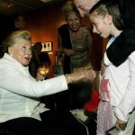 Film legend Esther Williams greets an admiring fan during a reception at the Academy of Motion Picture Arts and Sciences to screen the re-mastered digital presentation of the 1974 film, "That's Entertainment," in Beverly Hills September 17, 2004. REUTERS/Jeff Mitchell