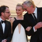epa03708277 (L-R) US director Ethan Coen, British actress Carey Mulligan and US musician T-Bone Burnett leave the screening of 'Inside Llewyn Davis' during the 66th annual Cannes Film Festival in Cannes, France, 19 May 2013. The movie was presented in the Official Competition of the festival which runs from 15 to 26 May. EPA/IAN LANGSDON