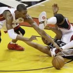 Miami Heat center Chris Bosh (1) Miami Heat power forward Udonis Haslem (40) and San Antonio Spurs center Boris Diaw (33) of France, vie for loose ball during the second half of Game 1 of the NBA Finals basketball game, Thursday, June 6, 2013 in Miami. The San Antonio Spurs won 92-88. (AP Photo/Wilfredo Lee)