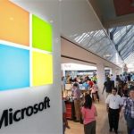 FILE - In this Thursday, Aug. 23, 2012 file photo, the Microsoft Corp. logo, left, is seen on an exterior wall of a new Microsoft store inside the Prudential Center mall, in Boston. Microsoft will use its annual developers conference to release a preview of Windows 8.1, a free update that promises to address some of the gripes people have with the latest version of the companys flagship operating system. The Build conference, which starts Wednesday, June 26, 2013, in San Francisco, will give Microsofts partners and other technology developers a chance to try out the new system before it becomes available to the general public later in the year. (AP Photo/Steven Senne, File)