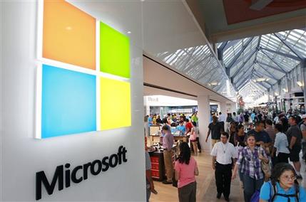 FILE - In this Thursday, Aug. 23, 2012 file photo, the Microsoft Corp. logo, left, is seen on an exterior wall of a new Microsoft store inside the Prudential Center mall, in Boston. Microsoft will use its annual developers conference to release a preview of Windows 8.1, a free update that promises to address some of the gripes people have with the latest version of the companys flagship operating system. The Build conference, which starts Wednesday, June 26, 2013, in San Francisco, will give Microsofts partners and other technology developers a chance to try out the new system before it becomes available to the general public later in the year. (AP Photo/Steven Senne, File)