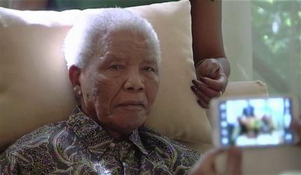 FILE - In this file image taken from video, the ailing anti-apartheid icon Nelson Madela is filmed Monday April 29, 2013, more than three weeks after being released from hospital.  The office of South Africa's president said Saturday, June 8, 2013 that Mandela has been taken to a hospital because of a lung infection. (AP Photo/SABC TV) SOUTH AFRICA OUT