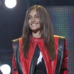 FILE - In this Oct. 8, 2011 file photo Paris Jackson smiles on stage at the Michael Forever the Tribute Concert, at the Millennium Stadium in Cardiff, Wales. Jackson is physically fine after being taken to a hospital early Wednesday, June 5, 2013, an attorney for Jackson's mother said. Perry Sanders Jr. writes in a statement that Paris Jackson is getting appropriate medical attention and the family is seeking privacy. Fire and sheriff's officials confirmed they transported someone from a home in Paris' suburban Calabasas neighborhood for a possible overdose but did not release any identifying information or additional details. (AP Photo/Joel Ryan, File)