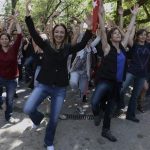 People dance in the city's Kugulu Park, where a group continue reading books, dancing or playing musical instruments in Ankara, Turkey, Friday, June 7, 2013. A senior European Union official, the EU enlargement commissioner Stefan Fule on Friday criticized Turkish police's harsh crackdown on protesters in the last week, asked that abusers be investigated and punished and told an audience that included Turkish prime minister Recep Tayyip Erdogan, that as a EU-candidate country, Turkey should aspire to the highest standards of democracy.(AP Photo)