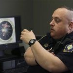 In this Tuesday, April 2, 2013 photo shows Brimfield Police Chief David Oliver talking about his facebook page in Kent, Ohio. Oliver uses the reach of his departments increasingly followed Facebook page to interact with residents and take to task criminals and other neer-do-wells, his preferred term is mopes, for the stupid, the silly and the outright unlawful in messages that mix humor and blunt opinion. (AP Photo/Tony Dejak)