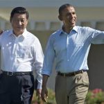 FILE - In this June 8, 2013, file photo, President Barack Obama and Chinese President Xi Jinping, left, walk at the Annenberg Retreat of the Sunnylands estate in Rancho Mirage, Calif. Over the past two weeks, Obama has argued with Xi over cybersecurity, huddled with world leaders over Syria and trade, declared his desire to reduce U.S. and Russian nuclear weapons, and embraced the uncertain steps toward reconciliation in Afghanistan. (AP Photo/Evan Vucci, File)