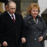 FILE - In this Sunday, March 4, 2012 file photo then Russian Prime Minister and presidential candidate Vladimir Putin and his wife Lyudmila leave a polling station in Moscow, Russia. Russian President Vladimir Putin and his wife Lyudmila have announced they are divorcing. Married just a few weeks short of 30 years, the Putins announced the decision on state television after attending a ballet performance Thursday evening in the Kremlin.( AP Photo/Alexander Zemlianichenko, file)