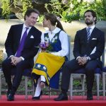 Swedish Princess Madeleine, center, her fiancée, New York banker Chris O'Neill, left, and her brother Prince Carl Philip seen during the traditional National Day celebrations at Skansen in Stockholm, Thursday June 6, 2013. (AP Photo/Scanpix Sweden/Henrik Montgomery) ** SWEDEN OUT **