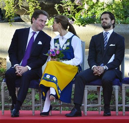 Swedish Princess Madeleine, center, her fiancée, New York banker Chris O'Neill, left, and her brother Prince Carl Philip seen during the traditional National Day celebrations at Skansen in Stockholm, Thursday June 6, 2013.    (AP Photo/Scanpix Sweden/Henrik Montgomery)  **  SWEDEN OUT  **
