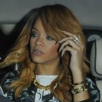 Rihanna is bundled into a car following her night out (Splash News)
