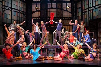 This theater image released by The O+M Company shows the cast during a performance of the musical "Kinky Boots." The Cyndi Lauper-scored "Kinky Boots," based on the 2005 British movie about a real-life shoe factory that struggles until it finds new life in fetish footwear, is nominated for 13 Tony Award nominations. The awards will be broadcast on CBS from Radio City Music Hall on June 9. (AP Photo/The O+M Company, Matthew Murphy)