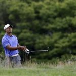 Tiger Woods watches his shot on the first hole during the first round of the U.S. Open golf tournament at Merion Golf Club, Thursday, June 13, 2013, in Ardmore, Pa. (AP Photo/Gene J. Puskar)