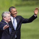 US President Barack Obama, right, waves next to German President Joachim Gauck after he was welcomed with military honors at the presidential residence Bellevue castle in Berlin, Germany, Wednesday, June 19, 2013. On the second day of his visit to Germany Obama is meeting with German President Gauck and German Chancellor Angela Merkel before delivering a speech at Brandenburg Gate. (AP Photo/Gero Breloer)