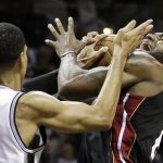 Miami Heat's LeBron James (6) is defended by San Antonio Spurs' Danny Green during the second half at Game 5 of the NBA Finals basketball series, Sunday, June 16, 2013, in San Antonio. (AP Photo/Eric Gay)