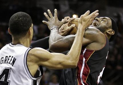 Miami Heat's LeBron James (6) is defended by San Antonio Spurs' Danny Green during the second half at Game 5 of the NBA Finals basketball series, Sunday, June 16, 2013, in San Antonio. (AP Photo/Eric Gay)