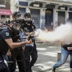 Police fire tear gas as riot police spray water cannon at demonstrators who remained defiant after authorities evicted activists from an Istanbul park, making clear they are taking a hardline against attempts to rekindle protests that have shaken the country, near city's main Taksim Square in Istanbul, Turkey, Sunday, June 16, 2013.(AP Photo )