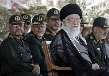 FILE - In this file photo released by the official website of the Iranian supreme leader's office on Monday, May 27, 2013, supreme leader Ayatollah Ali Khamenei, foreground right, attends a graduation ceremony of a group of Revolutionary Guard members, in Tehran, Iran. The polls are open in Iran, in the country's election to pick a successor to President Mahmoud Ahmadinejad. Six candidates remain in the race: a moderate, four conservatives and a hard-liner, and they're all loyal to Supreme Leader Ayatollah Ali Khamenei, who cast his vote Friday, June 14, 2013. Shortly after, he said on national television, "Recently I have heard that a U.S. security official has said they do not accept this election. OK, the hell with you." (AP Photo/Office of the Supreme Leader, File)