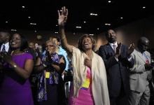 Hazel Dukes, a member of the board of directors of the National Association for the Advancement of Colored People (NAACP), cheers at the end of a speech by NAACP president Benjamin Jealous  to the 2013 NAACP convention in Orlando, Florida July 15, 2013. In the wake of the George Zimmerman murder trial, civil rights leaders, including Jealous, are urging the Justice Department to pursue federal civil rights charges against Zimmerman.  REUTERS/David Manning  (UNITED STATES - Tags: POLITICS TPX IMAGES OF THE DAY)