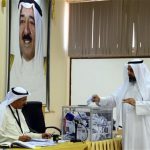 A Kuwaiti man cast his vote at a polling station in Rumaithiya