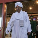 Sudanese President Omar al-Bashir walks out of a hotel in Abuja July 14, 2013. REUTERS/Afolabi Sotunde