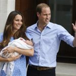 Britain's Prince William, right, and Kate, Duchess of Cambridge, hold the Prince of Cambridge, Tuesday July 23, 2013, as they pose for photographers outside St. Mary's Hospital exclusive Lindo Wing in London where the Duchess gave birth on Monday July 22. The Royal couple are expected to head to Londons Kensington Palace from the hospital with their newly born son, the third in line to the British throne. (AP Photo/Kirsty Wigglesworth)