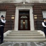 British police officers guard the entrance of St. Mary's Hospital exclusive Lindo Wing in London, Monday, July 22, 2013. Buckingham Palace officials say Prince William's wife, Kate, has been admitted to the hospital in the early stages of labour. Royal officials said that Kate traveled by car to St. Mary's Hospital in central London. Kate _ also known as the Duchess of Cambridge _ is expected to give birth in the private Lindo Wing of the hospital, where Princess Diana gave birth to William and his younger brother, Prince Harry.The baby will be third in line for the British throne _ behind Prince Charles and William _ and is anticipated eventually to become king or queen. (AP Photo/Lefteris Pitarakis)