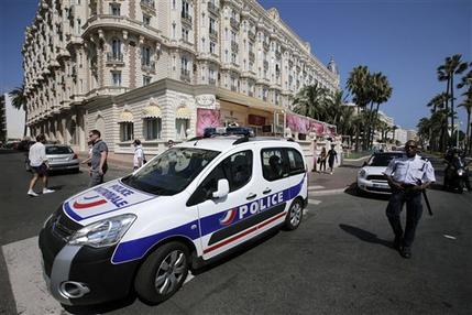 A view of the Carlton hotel, in Cannes, southern France, the scene of a daylight raid, Sunday, July 28, 2013. A staggering 40 million euro ($53 million) worth of jewels and diamonds were stolen Sunday from the Carlton Intercontinental Hotel in Cannes, in one of Europe's biggest jewelry heists recent years, police said. French Riviera hotel was hosting a temporary jewelry exhibit over the summer of the prestigious Leviev diamond house, which is owned by Israeli billionaire Lev Leviev. (AP Photo/Lionel Cironneau)